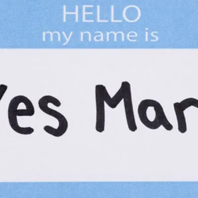 Name sticker which says "Hello my name is Yes Man"