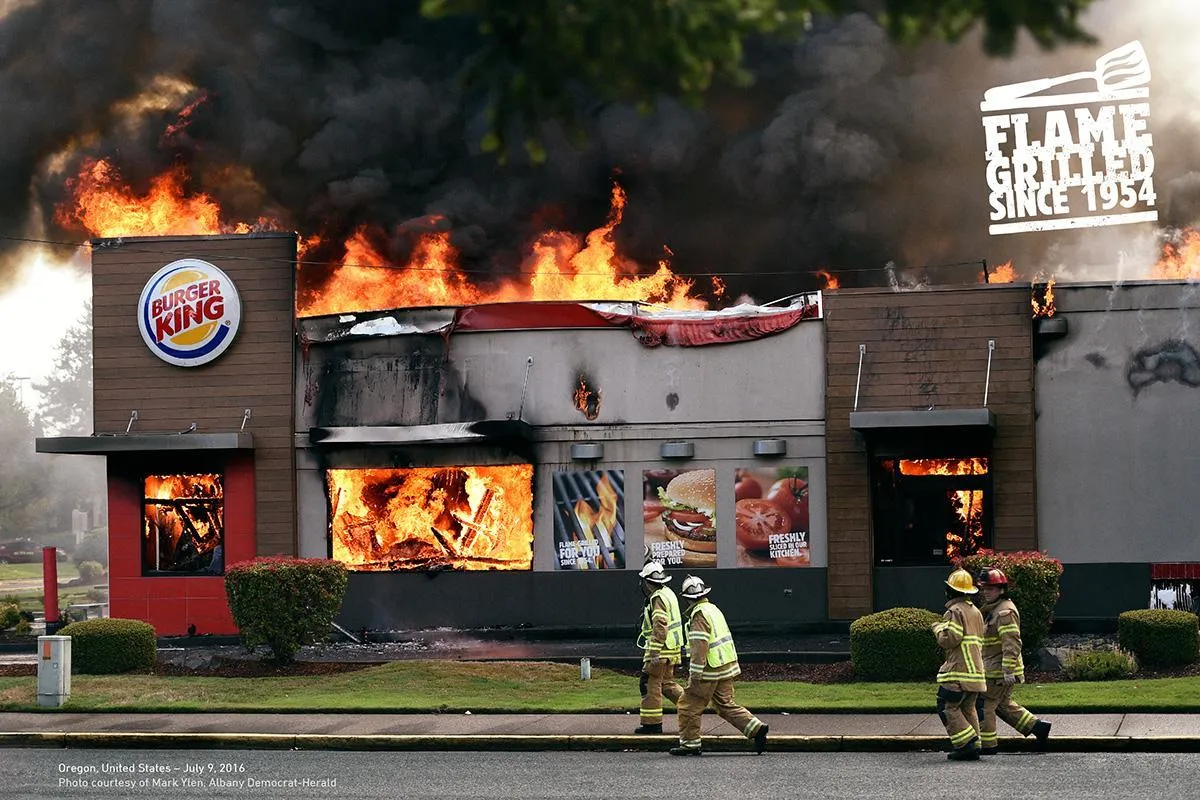 A Burger King on fire with the slogan 