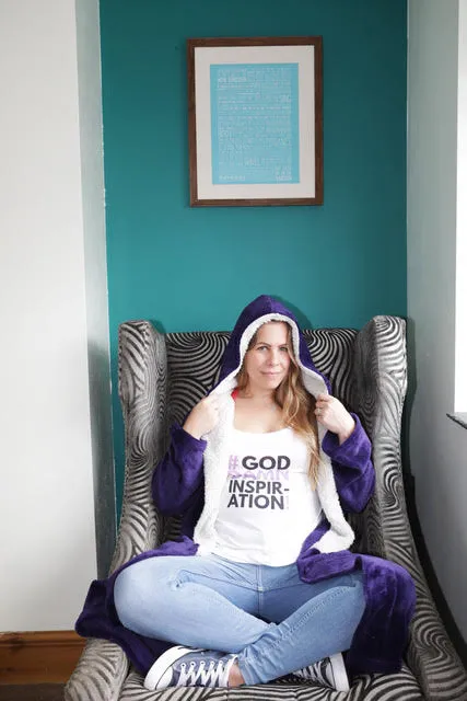 Jo Watson, sat in a large arm chair with the framed song lyrics of Everybody's Free To Wear Sunscreen, on the wall behind her. 