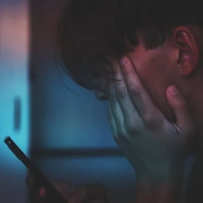 guy with his head in his hands