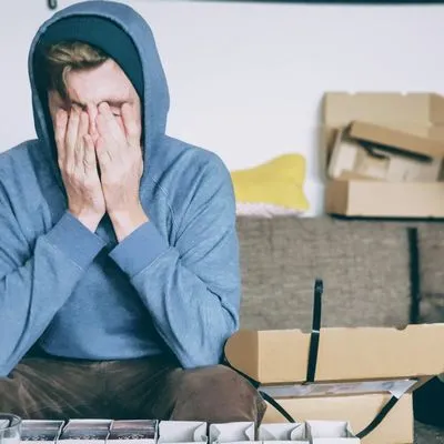 Guy with his head in his hands