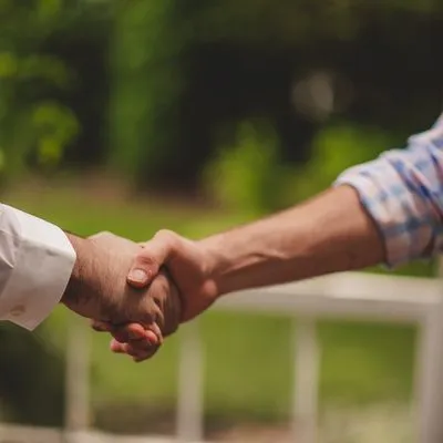 Two people shaking hands.