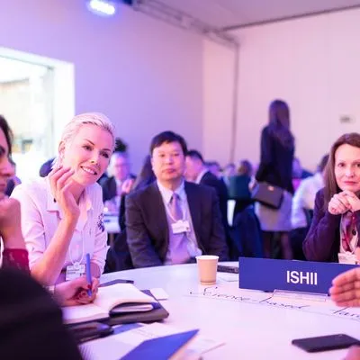 Group of people at a round table event.
