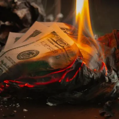 100 dollar bills on fire