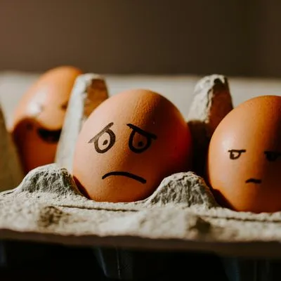 Eggs with grumpy and sad faces drawn on them
