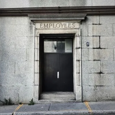 Door with "employees" written above it. 