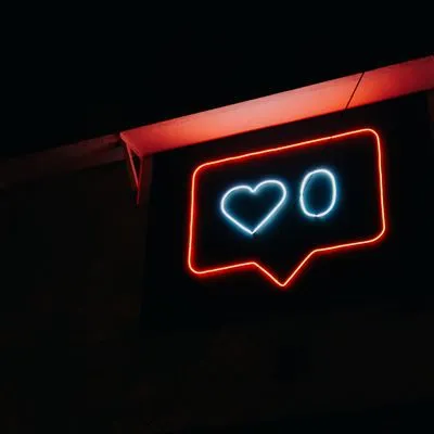 Neon sign with a heart and zero. 