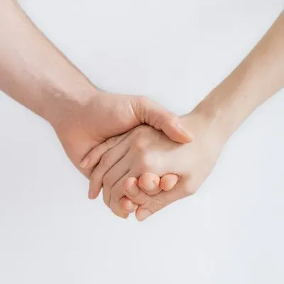 woman and man holding hands
