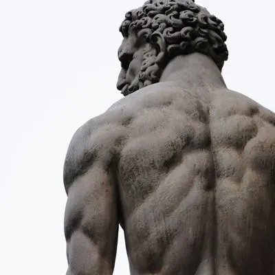 Muscular stone sculpture of Hercules 