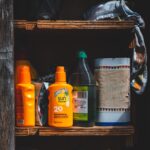 Open cabinet with bottles of suncream instead